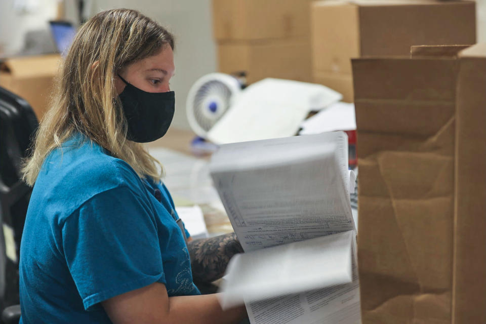 An ATF worker flips through gun sale records in Martinsburg, W.Va. (Peter Kavanagh / NBC News)