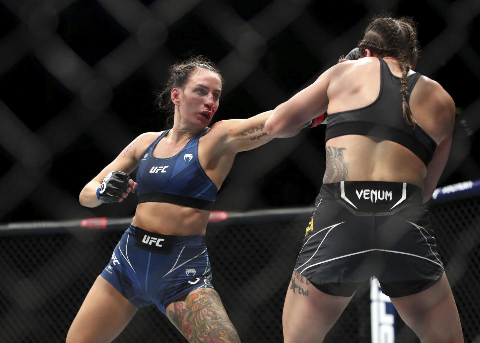 Casey O'Neill, left, and Jennifer Maia in action during their flyweight bout in the UFC 286 mixed martial arts event at O2 Arena, in London, Saturday, March 18, 2023. (Kieran Cleeves/PA via AP)