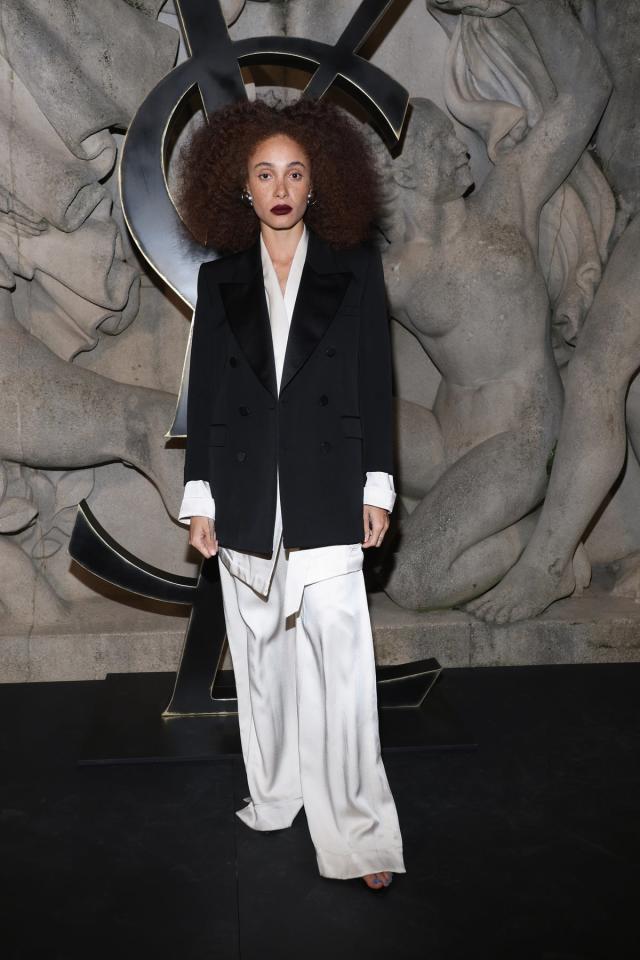 A guest poses with a Louis Vuitton bag after the Vivienne Westwood News  Photo - Getty Images