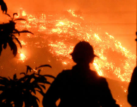 Firefighters keep a close watch on the Thomas wildfire in the hills outside Montecito, California, U.S., December 16, 2017. REUTERS/Gene Blevins