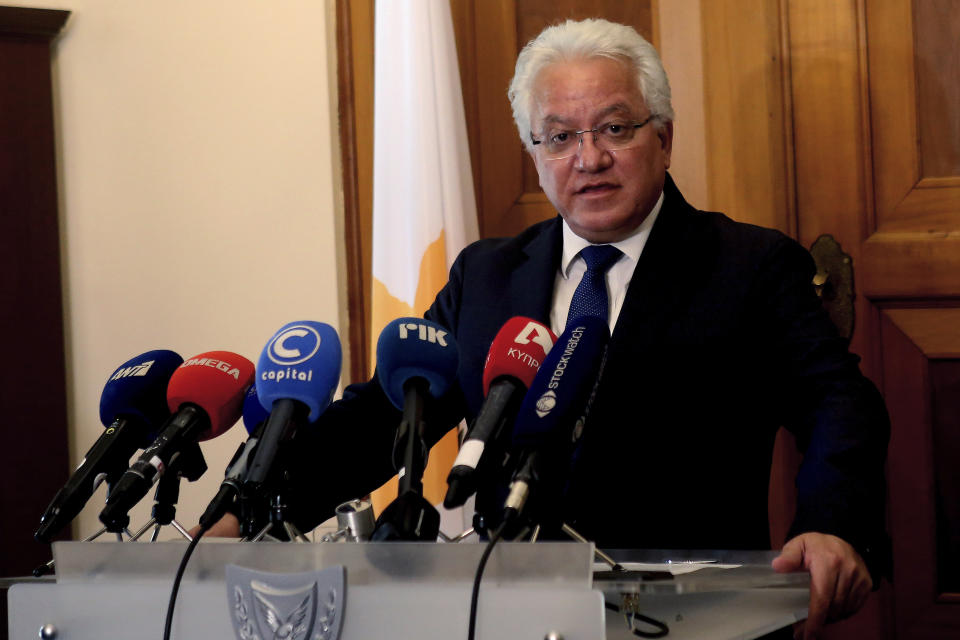 Cyprus' Justice Minister Ioanas Nicolaou talks to the media after a meeting with Cyprus' president Nicos Anastasiades at the presidential palace in capital Nicosia, Cyprus, Thursday, May 2, 2019. Nicolaou has resigned over the case of a serial killer who has confessed to killing seven foreign women and girls amid mounting reports that police had bungled their investigation when some of the victims were initially reported missing. (AP Photo/Philippos Christou)