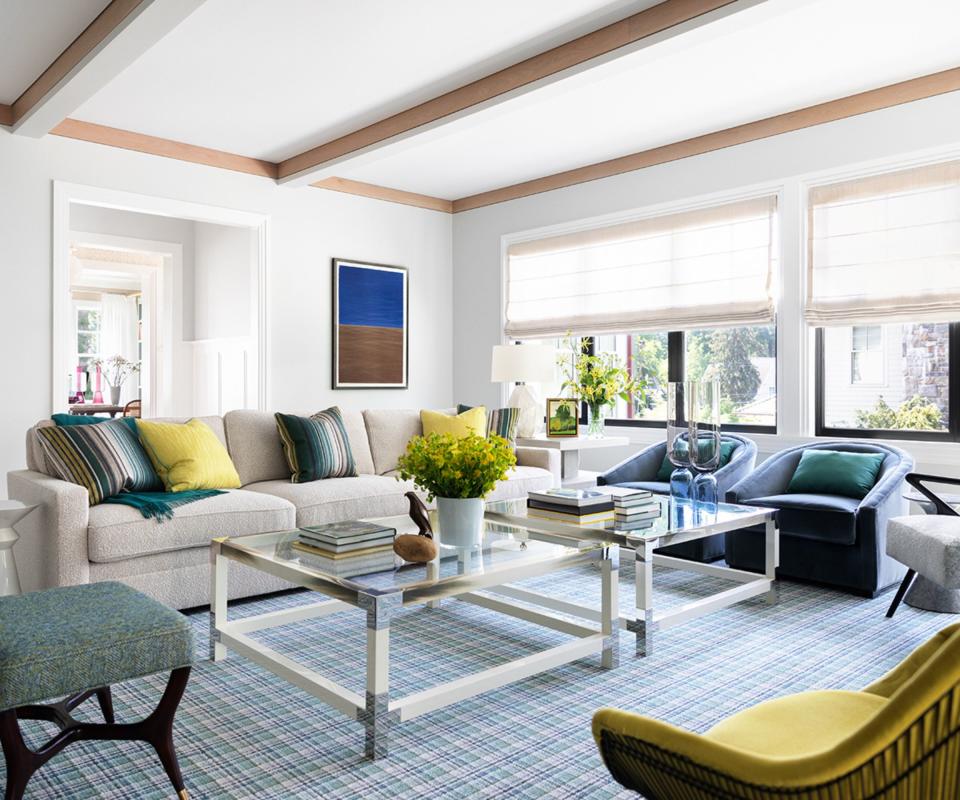 living room with white sofa and colorful cushions