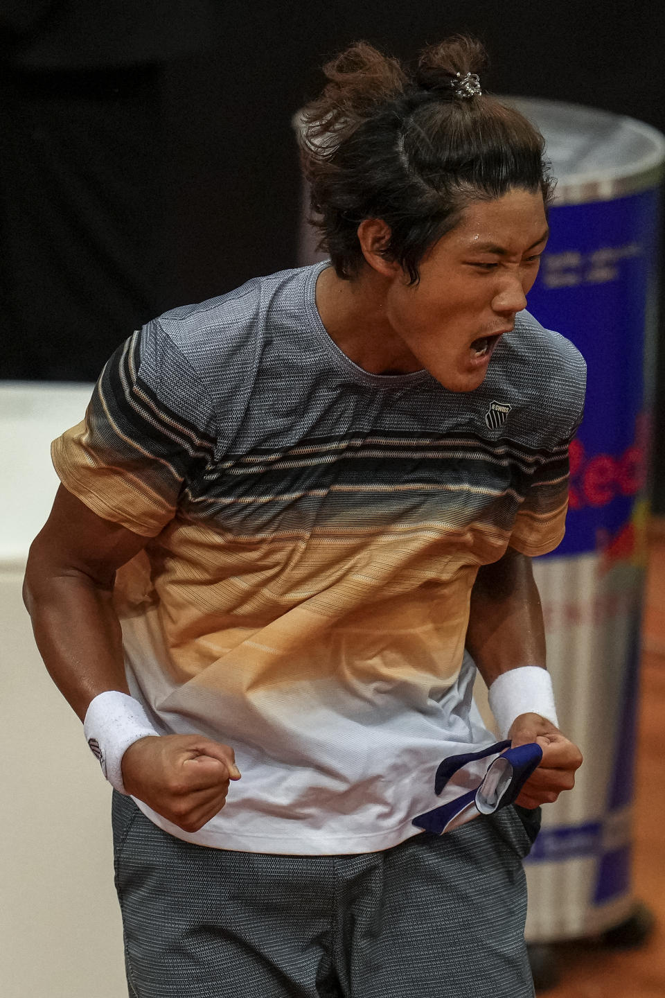 Zhang Zhizhen of China celebrates his victory over Taylor Fritz, of the United States, at the Madrid Open tennis tournament in Madrid, Spain, Tuesday, May 2, 2023. (AP Photo/Manu Fernandez)