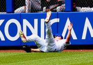 Jun 6, 2018; New York City, NY, USA; New York Mets right fielder Jay Bruce (19) makes a diving catch against the Baltimore Orioles during the seventh inning at Citi Field. Mandatory Credit: Andy Marlin-USA TODAY Sports