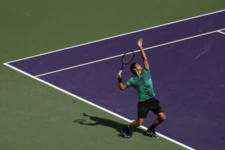 Mar 30, 2017; Miami, FL, USA; Roger Federer of Switzerland serves against Tomas Berdych of the Czech Republic (not pictured) in a men's singles quarter-final during the 2017 Miami Open at Crandon Park Tennis Center. Federer won 6-2, 3-6, 7-6(6). Mandatory Credit: Geoff Burke-USA TODAY Sports