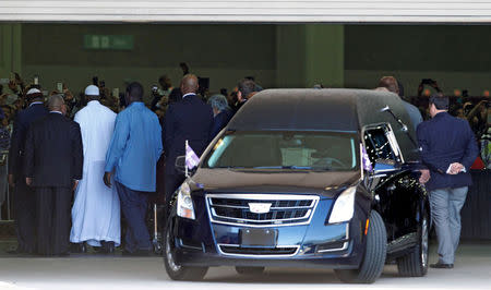 A hearse arrives with the casket of the late Muhammad Ali. REUTERS/John Sommers II