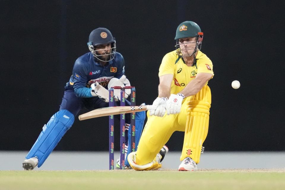 Australia's Mitchell Marsh plays a shot as Sri Lanka's wicketkeeper Kusal Mendis watches during the fifth one-day international cricket match between Australia and Sri Lanka in Colombo, Sri Lanka, Friday, June 24, 2022. (AP Photo/Eranga Jayawardena)