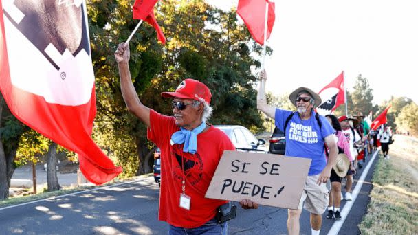 PHOTO: Fresno farm worker Asuncionn Ponce marches with fellow United Farm Workers members from Walnut Grove, Calif. to Elk Grove, Calif., Aug. 24, to urge Gov. Gavin Newsom to sign AB 2183, a bill allowing farm workers to vote by mail in union elections. ((Jessica Christian/San Francisco Chronicle via AP, FILE)