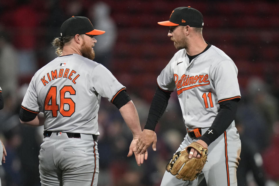 Baltimore Orioles pitcher Craig Kimbrel celebrates with Jordan Westburg (11) after defeating the Boston Red Sox 7-5 following a baseball game, Wednesday, April 10, 2024, in Boston. Westburg drove in three-runs on a home run and Kimbrel earning a save in the win. (AP Photo/Charles Krupa)