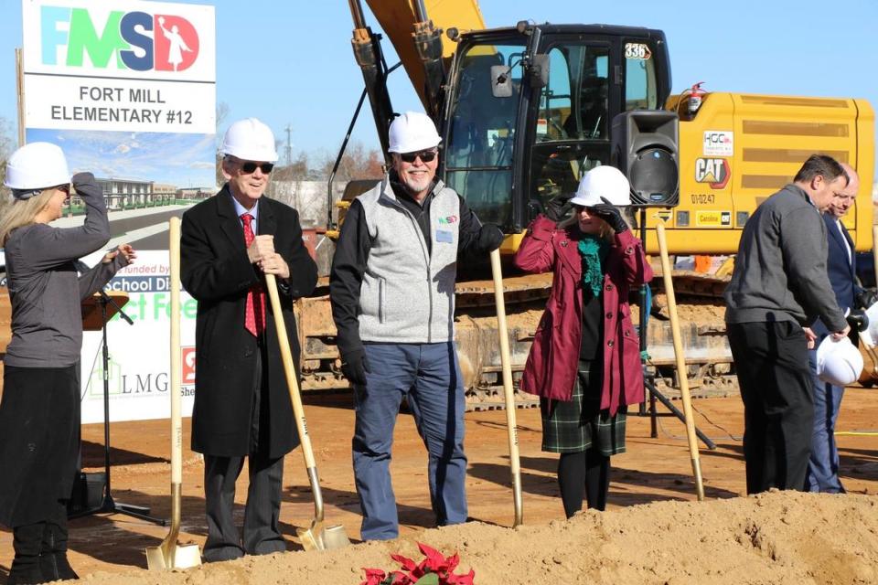 District staff and board members break ground on a new elementary school in Fort Mill, funded by impact fees. A school bond referendum vote in March allows for a new middle school at the same site. Both schools will be named Flint Hill.