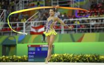<p>Laura Zeng (USA) of USA competes using the ribbon. (Reuters) </p>
