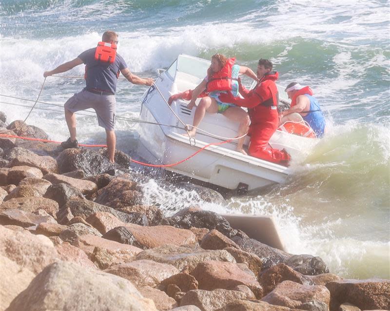 Bourne firefighters rescued a man and woman off a boat that had lost power on Wings Neck on Sunday afternoon.