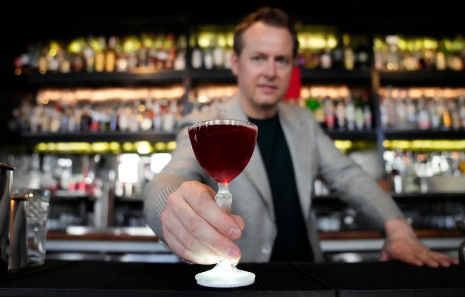 Ross Simon serves up the M.V.P. (Miami Vice Punch) at the Bitter & Twisted Cocktail Parlor in downtown Phoenix.