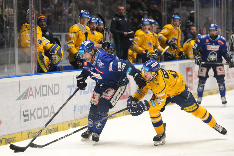 Jaromir Jagr, left, of Kladno Knights, controls the puck during the first Czech hockey league match against Ceske Budejovice in Kladno, Czech Republic, Sunday, Jan. 21, 2024. (AP Photo/Petr David Josek)