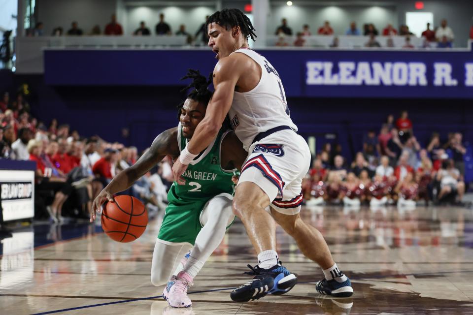 Jan 28, 2024; Boca Raton, Florida, USA; North Texas Mean Green guard Jason Edwards (2) drives to the basket against Florida Atlantic Owls guard Bryan Greenlee (4) during the first half at Eleanor R. Baldwin Arena. Mandatory Credit: Sam Navarro-USA TODAY Sports