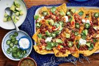 <p>Messy? Maybe. Worth it? Yes. The secret to <a href="https://www.southernliving.com/recipes/sheet-pan-nachos-recipe" rel="nofollow noopener" target="_blank" data-ylk="slk:fully loaded nachos;elm:context_link;itc:0;sec:content-canvas" class="link ">fully loaded nachos</a> that won’t fall apart in your lap? A mixture of <a href="https://www.southernliving.com/food/entertaining/salsa-recipes" rel="nofollow noopener" target="_blank" data-ylk="slk:salsa;elm:context_link;itc:0;sec:content-canvas" class="link ">salsa</a> and refried beans acts like the “glue” to help the toppings stick to the tortilla chips.</p> <p><a href="https://www.myrecipes.com/recipe/sheet-pan-nachos-chorizo-refried-beans" rel="nofollow noopener" target="_blank" data-ylk="slk:Sheet Pan Nachos with Chorizo and Refried Beans Recipe;elm:context_link;itc:0;sec:content-canvas" class="link ">Sheet Pan Nachos with Chorizo and Refried Beans Recipe</a></p>