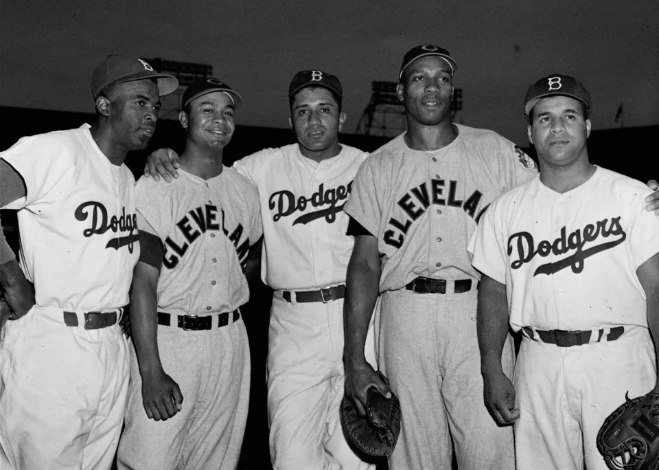 ADVANCE FOR WEEKEND EDITIONS, JULY 5-6--FILE--Black players on the Brooklyn Dodgers and Cleveland Indians teams pose at Ebbets Field in Brooklyn in this July 24, 1950 file photo. Left to right,  Jackie Robinson, Brooklyn; Larry Doby, Cleveland; Don Newcombe, Brooklyn; Luke Easter, Cleveland; and Roy Campanella, Brooklyn. Doby, who broke the color barrier in the American League in 1947, will be honored at the All-Star game in Cleveland on Tuesday, July 8, 1997.(AP Photo) ORG XMIT: NY140