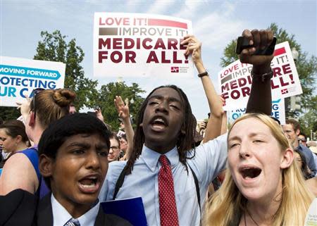 Supporters of the Affordable Healthcare Act celebrate in front of the Supreme Court after the court upheld the legality of the law in Washington June 28, 2012. REUTERS/Joshua Roberts