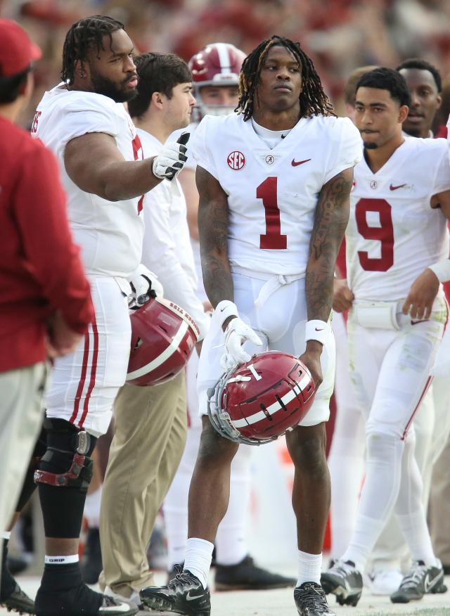 Alabama wide receiver Jameson Williams, left, at the NFL Red Carpet Stage  on Thursday, April 28 …