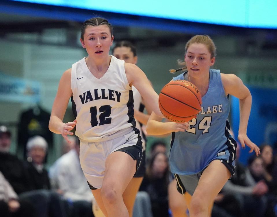 Putnam Valley's Ava Harman (12) works past Westlake's Catherine Nebel (24) in the Section 1 Class B girls basketball championship game at the Westchester County Center in White Plains on Friday, March 1, 2024.