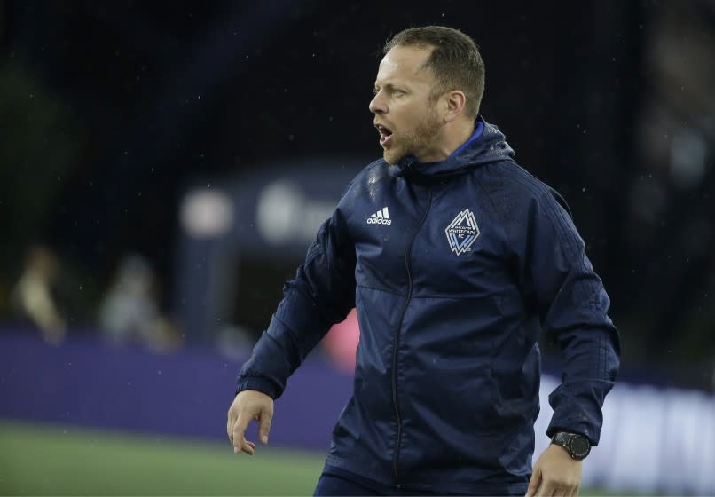 Vancouver Whitecaps head coach Marc Dos Santos shouts from the bench during the first half of an MLS soccer match against the New England Revolution, Wednesday, July 17, 2019, in Foxborough, Mass. The Revolution won 4-0. (AP Photo/Steven Senne)