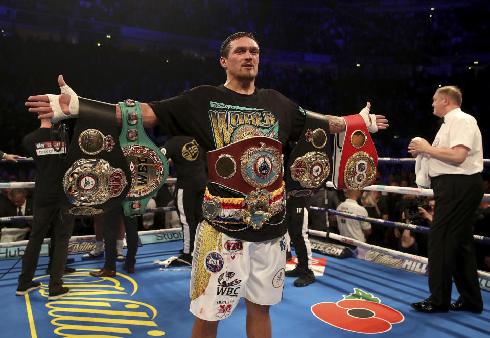 Oleksandr Usyk celebrates his victory against Tony Bellew in their cruiserweight boxing bout Saturday, Nov. 10, 2018, in Manchester, England. (Nick Potts/PA via AP)