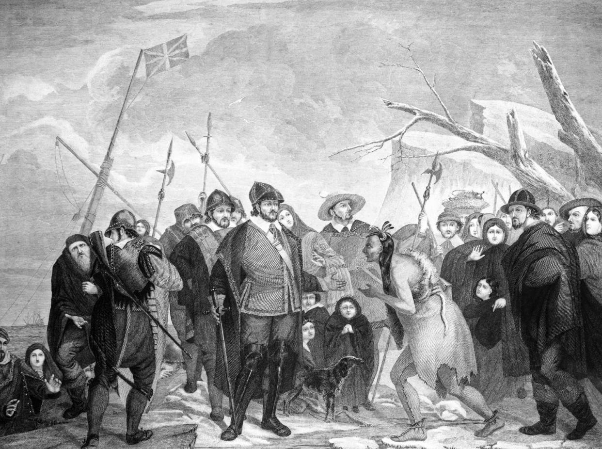 IMage: The 1620 landing of pilgrim colonists at Plymouth Rock, MA. (Charles Phelps Cushing/ClassicStock / Getty Image)