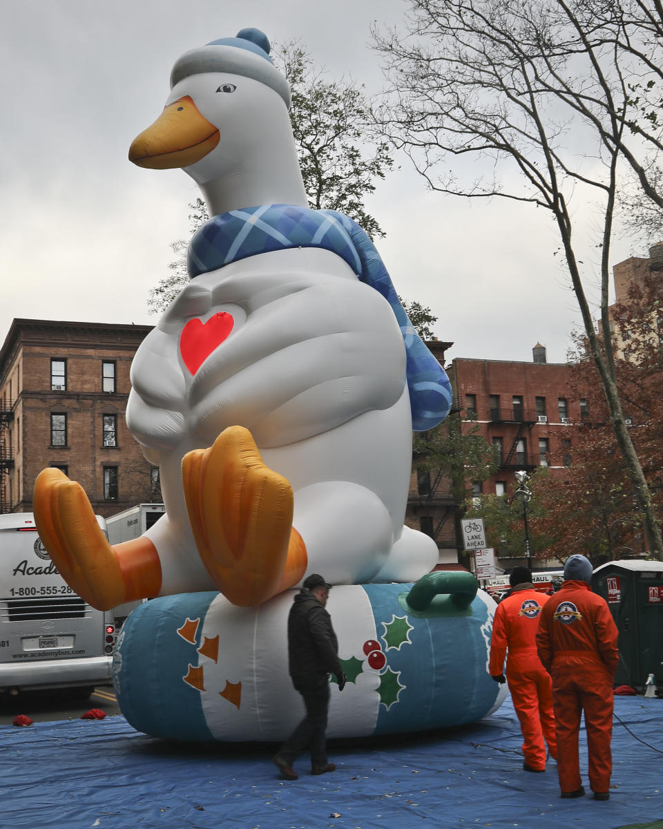 A giant balloon of the Aflac Duck is inflated the night before their appearance in the 92nd Macy's Thanksgiving Day parade, Wednesday Nov. 21, 2018, in New York. (AP Photo/Bebeto Matthews)