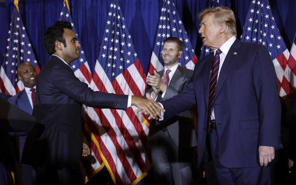 Donald Trump shakes hands with former candidate Vivek Ramaswamy