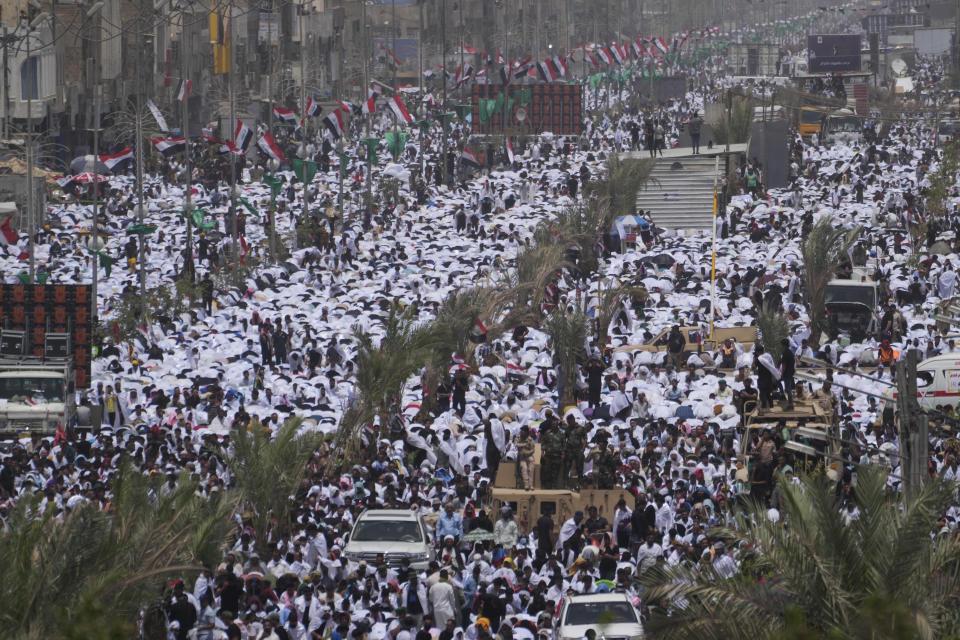 Followers of Shiite cleric Muqtada al-Sadr chant slogans during an open-air Friday prayers in Sadr City, Baghdad, Iraq, Friday, July 15, 2022. (AP Photo/Hadi Mizban)