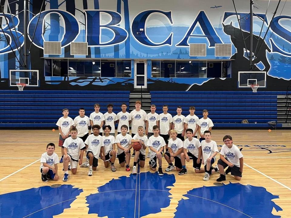 A group of Cambridge boys basketball campers pose for a photo  before getting to work earlier this summer.