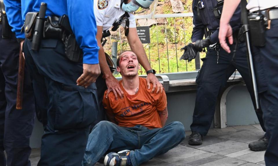 NYPD police officers arrest a protester during a demonstration on Monday.