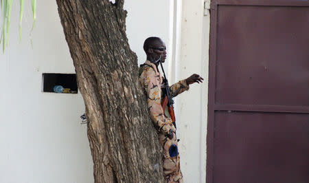 A South Sudanese policeman stands inside a compound following renewed fighting in South Sudan's capital Juba, July 10, 2016. REUTERS/Stringer