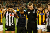 Alastair Clarkson and Nathan Buckley stand united as they remember their fellow coach.