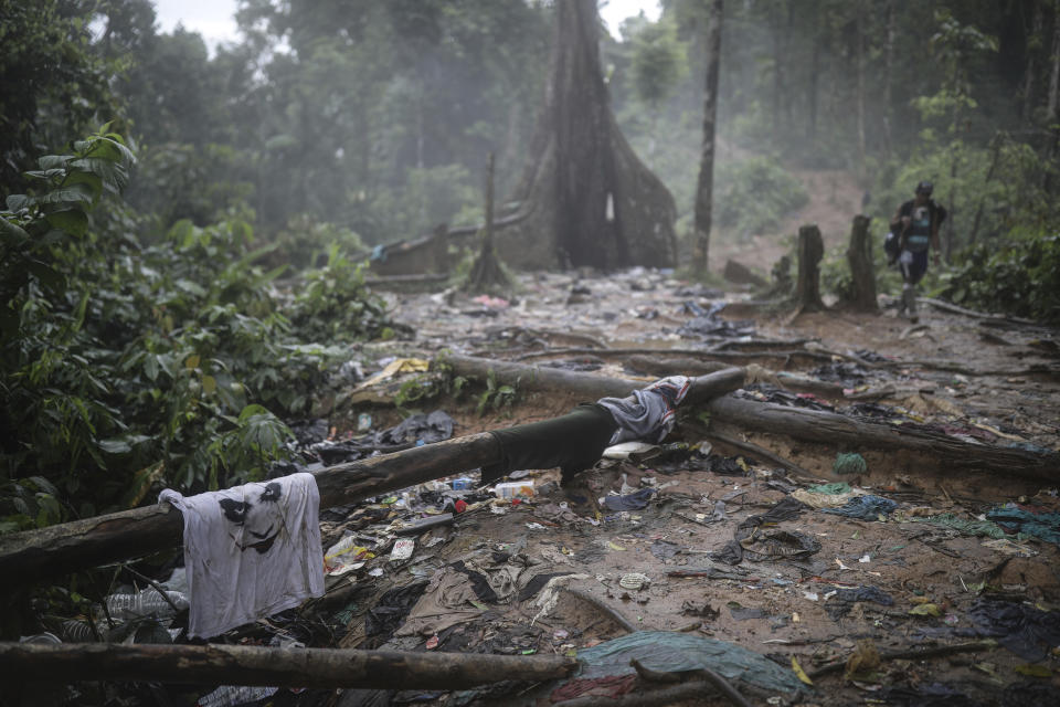 FILE - Clothing and garbage litter the trail where migrants have been trekking across the Darien Gap from Colombia to Panama in hopes of eventually reaching the United States, May 10, 2023. (AP Photo/Ivan Valencia, File)