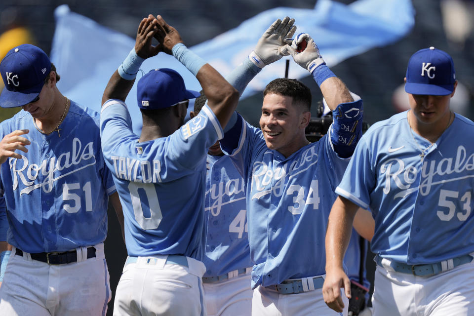 Kansas City Royals' Freddy Fermin (34) celebrates with teammates after hitting a two-run double to win the baseball game during the tenth inning Thursday, June 29, 2023, in Kansas City, Mo. The Royals won 3-2 in ten innings. (AP Photo/Charlie Riedel)