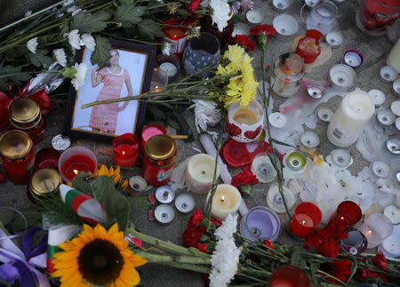 Flowers and candles are placed in memory of Bulgarian TV journalist Viktoria Marinova in Ruse, Bulgaria, October 9, 2018. REUTERS/Stoyan Nenov