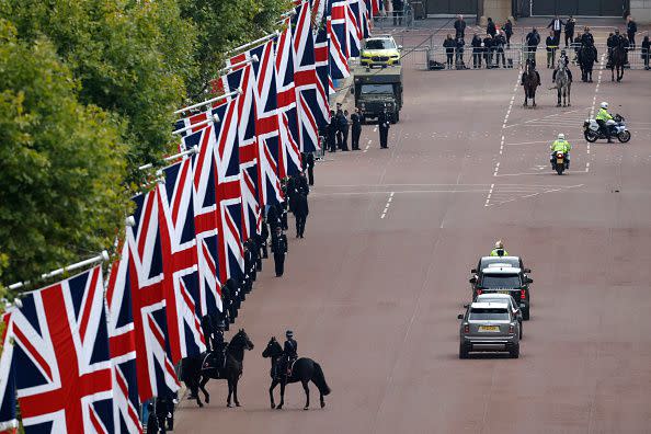 LONDON, ENGLAND - SEPTEMBER 19: King Charles III's motorcade is driven along The Mall ahead of The State Funeral of Queen Elizabeth II on September 19, 2022 in London, England. Elizabeth Alexandra Mary Windsor was born in Bruton Street, Mayfair, London on 21 April 1926. She married Prince Philip in 1947 and ascended the throne of the United Kingdom and Commonwealth on 6 February 1952 after the death of her Father, King George VI. Queen Elizabeth II died at Balmoral Castle in Scotland on September 8, 2022, and is succeeded by her eldest son, King Charles III.  (Photo by Chip Somodevilla/Getty Images)