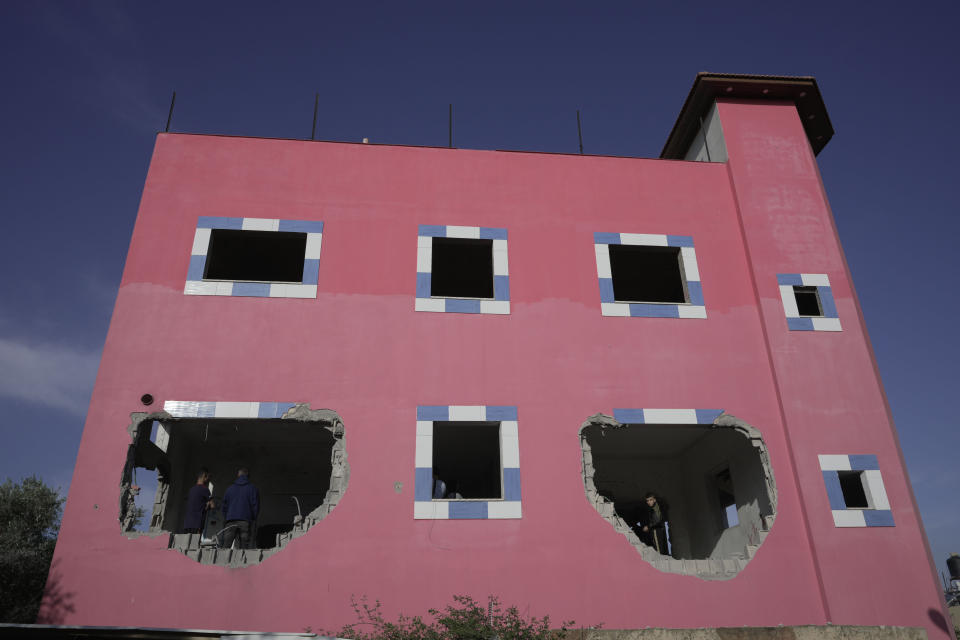 Palestinians check demolished home in the West Bank village of Silat al-Harithiya, near Jenin, Saturday, May 7, 2022. Israeli forces demolished a home of Omar Jaradat who was part of a group who shot and yeshiva student Yehuda Dimentman in the West Bank in December 2021. (AP Photo/Majdi Mohammed)