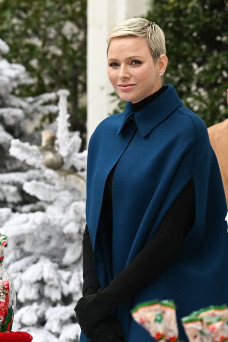 Princess Charlene in a blue cape