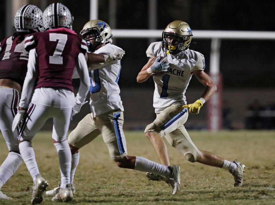 Monache's Ty Baxter hits the line against Daymion Soto during their high school football game at the Mineral King Bowl in Visalia, Calif., Friday, Oct. 20, 2023.