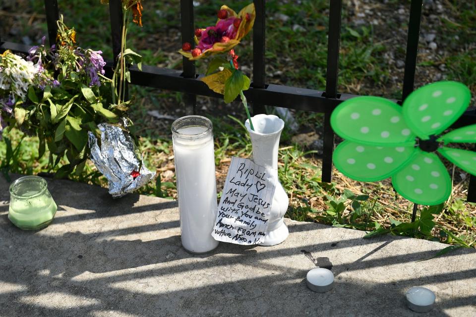 A memorial stands at 75th Street and Stewart Avenue, in Chicago, Tuesday, July 30, 2019 where two women were slain in a drive-by shooting Friday night.