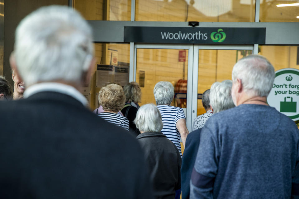 People are seen waiting for the opening of Woolworths supermarket in Balmain on March 17, 2020 in Sydney, Australia. 