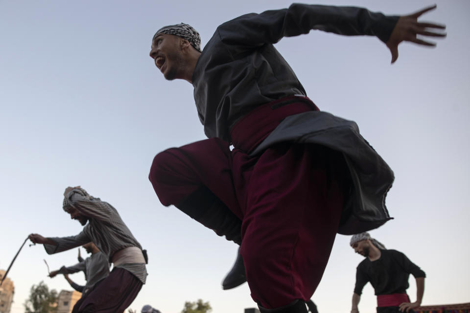 Palestinians wear a traditional uniform perform during a folklore dancing festival in Gaza City, Thursday, Oct. 7, 2021. (AP Photo/Khalil Hamra)