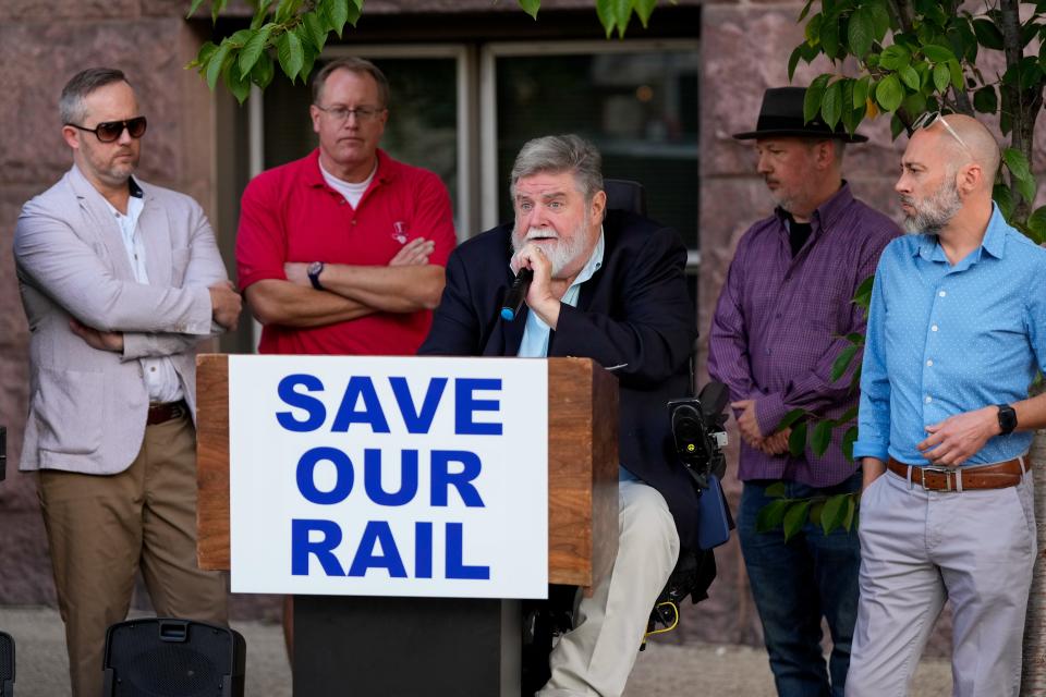 The Save Our Rail group speaks in opposition of the proposed sale of the Cincinnati Southern Railway to Norfolk Southern Corp. during a press conference outside of City Hall in downtown Cincinnati.