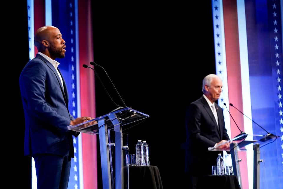 Republican U.S. Senate candidate Ron Johnson, right, and Democratic U.S. Senate candidate Mandela Barnes participate during a televised debate Thursday, Oct. 13, 2022, in Milwaukee.