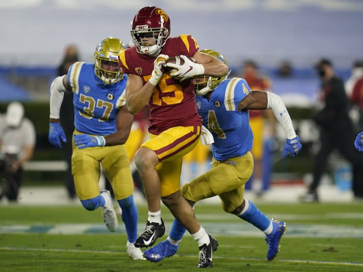 USC wide receiver Drake London runs to the end zone on a 65-yard touchdown against UCLA on Dec. 12, 2020.