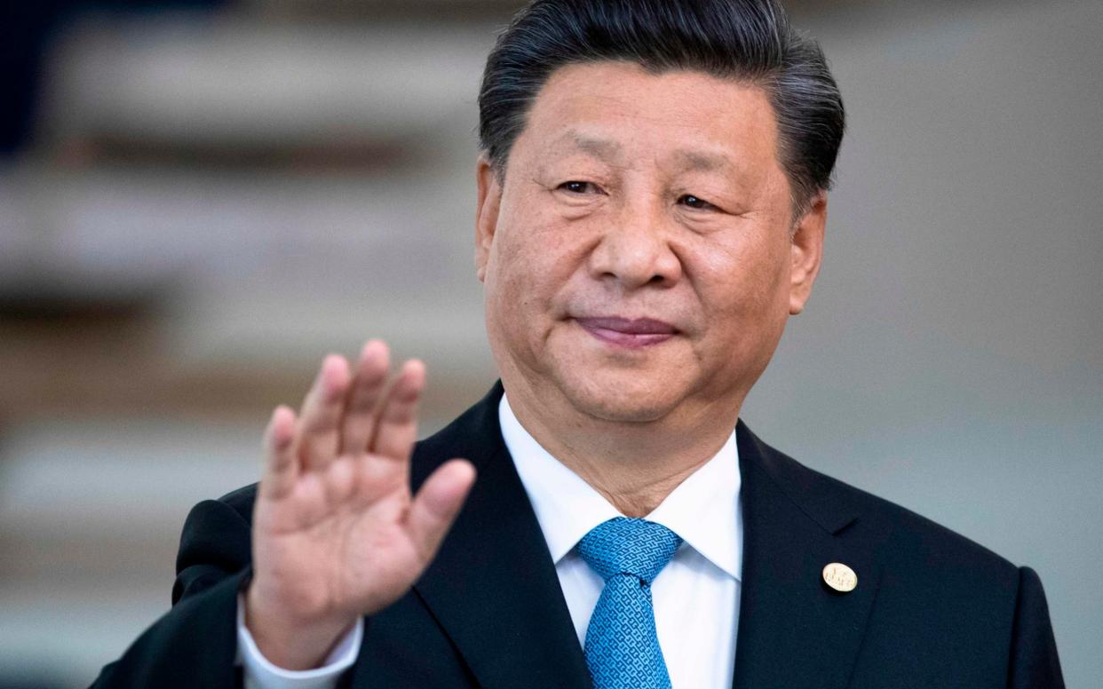 Xi Jingping, China's leader, gestures at a press conference - AFP