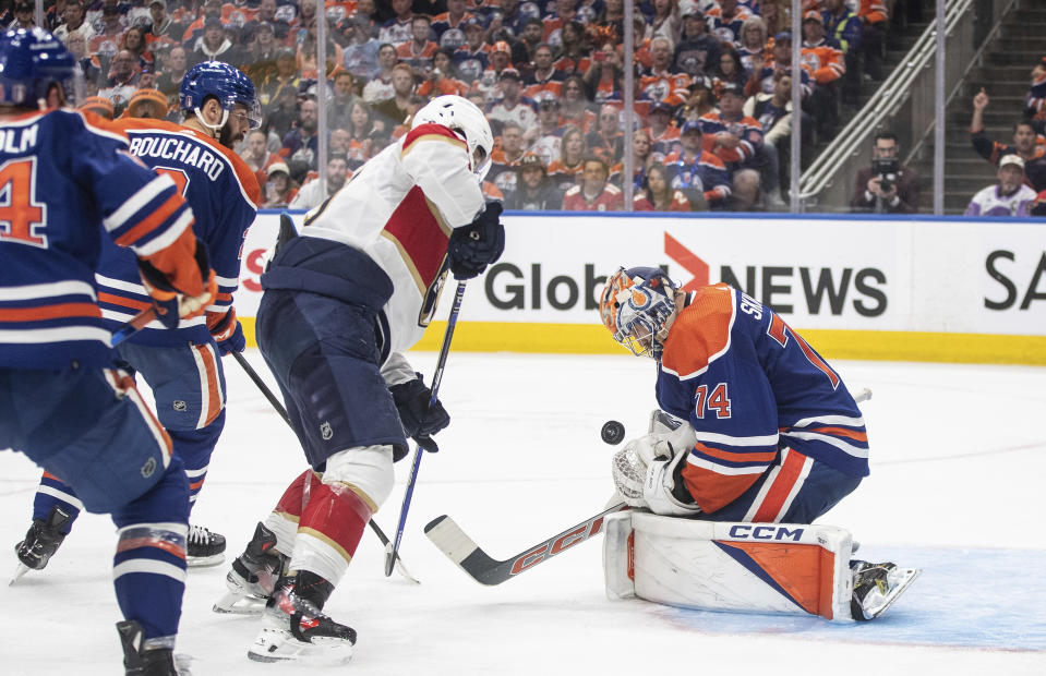 Florida Panthers' Matthew Tkachuk (19) is stopped by Edmonton Oilers goalie Stuart Skinner (74) during the third period of Game 6 of the NHL hockey Stanley Cup Final, Friday, June 21, 2024, in Edmonton, Alberta. The Oilers won 5-1 to tie the series. (Jason Franson/The Canadian Press via AP)