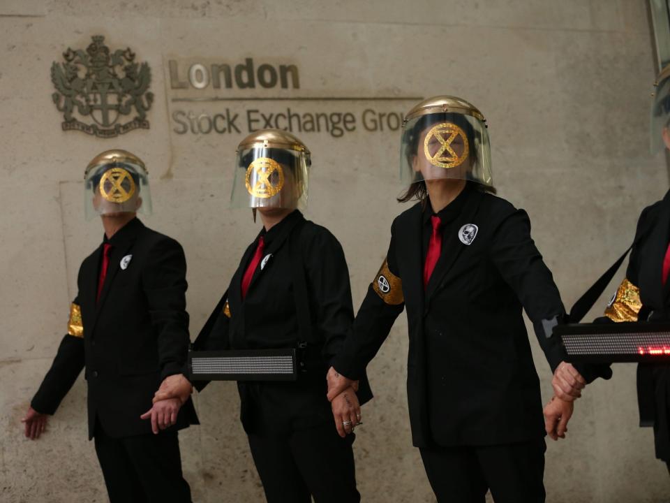 Extinction Rebellion: Climate change protesters glue themselves to London Stock Exchange